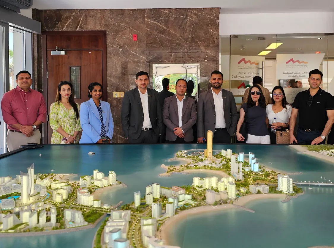 Office team listening to speaker in conference room
